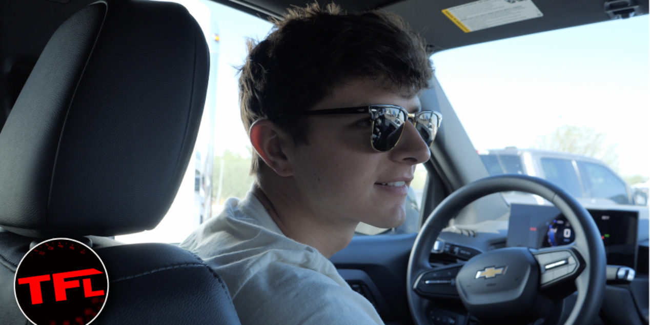 A Man Sitting in the Driver's Seat of a Chevrolet Vehicle