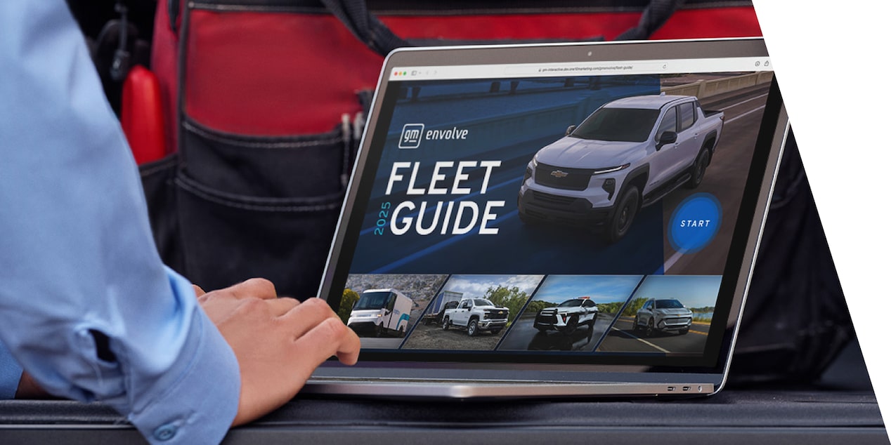 A computer displaying the GM Envolve fleet guide and manuals page.
