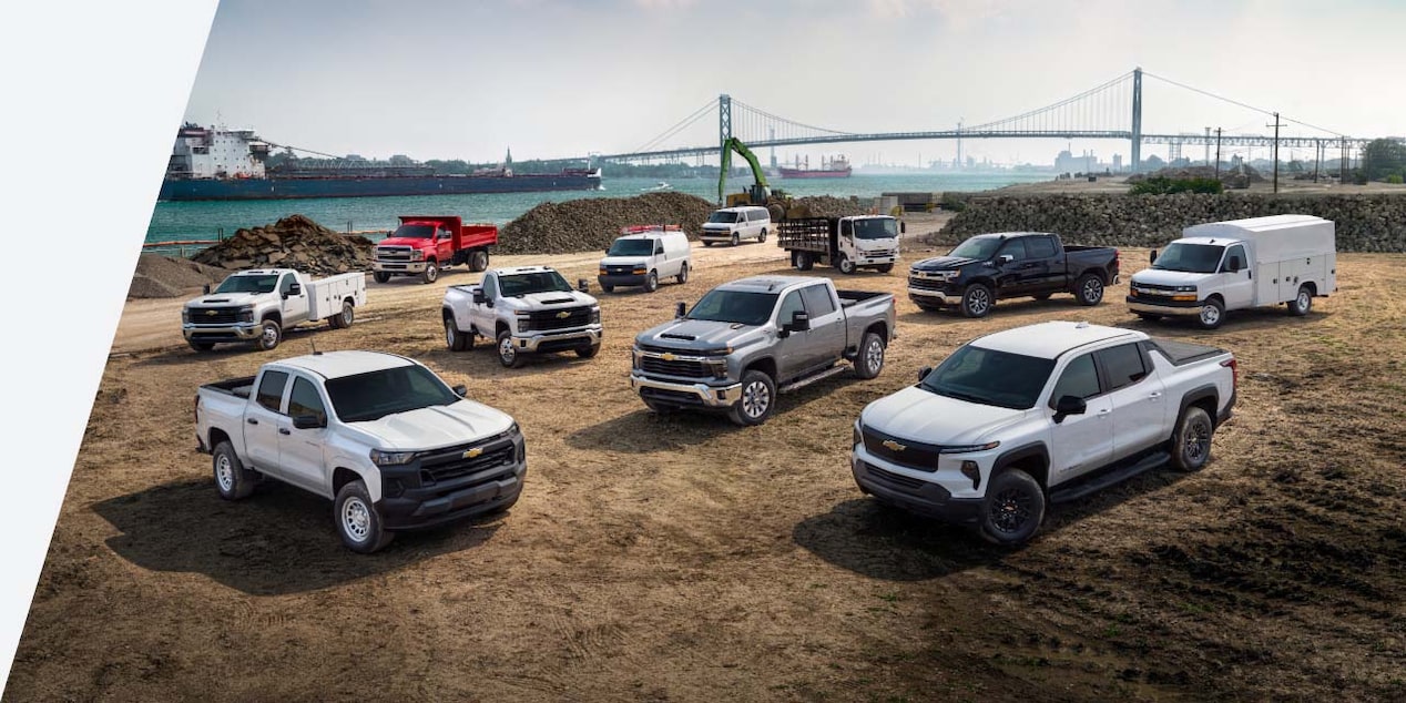 A group of GM vehicles on a job site.