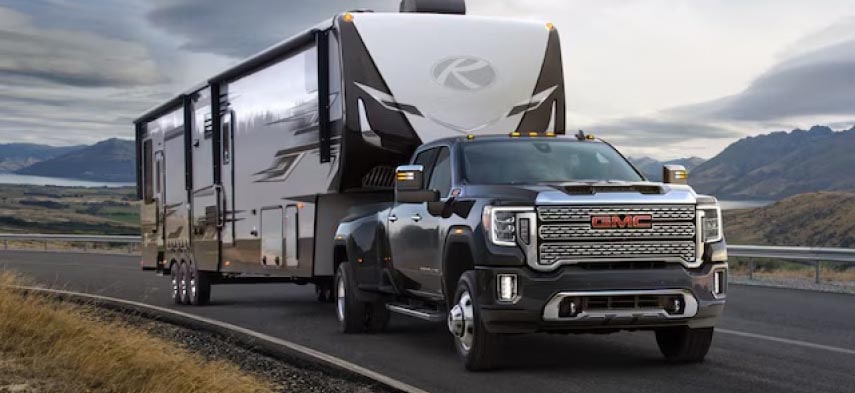 a GMC truck pulling a trailer