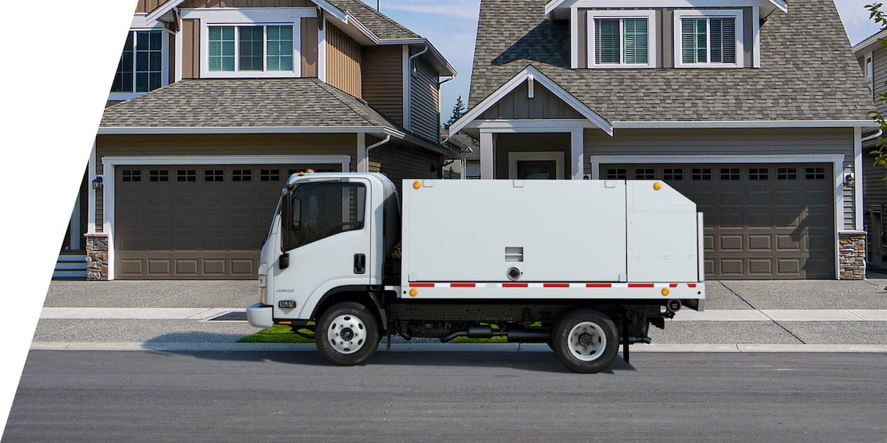 Chevrolet Low Cab Forward In Front of Homes