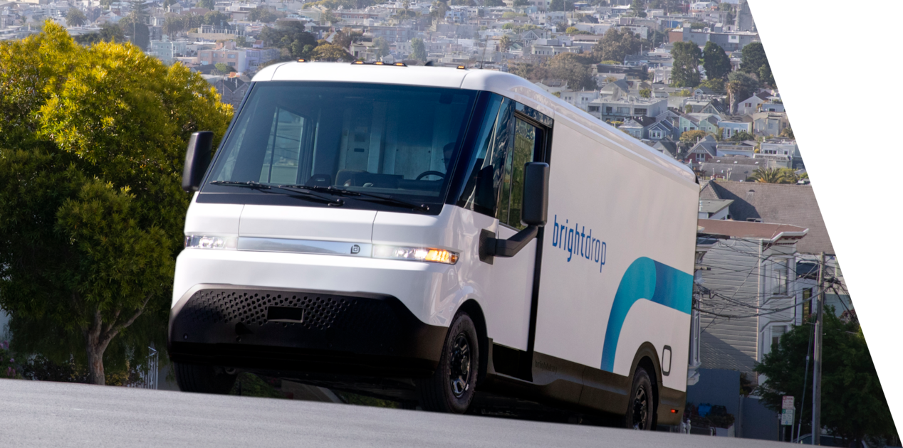 Front Three-Quarters View of the BrightDrop Zevo Electric Delivery Vehicle Driving Up a Hill