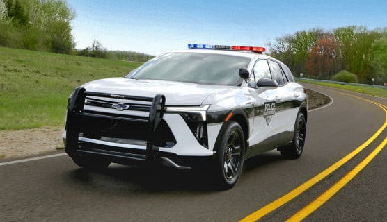 A 2024 Chevrolet Blazer EV PPV Driving on a Road.