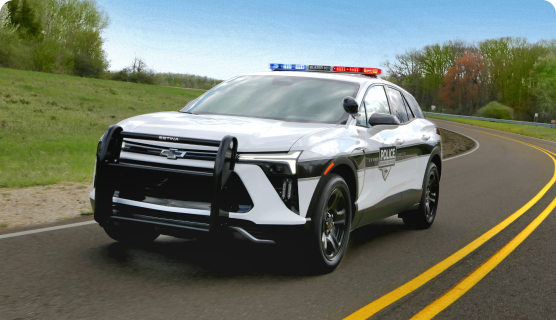 Front Three-Quarters View of a Chevrolet Blazer PPV Driving on a Road