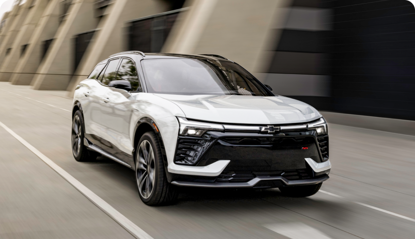 Front Three-Quarters View of a Chevrolet Blazer Driving on a Road