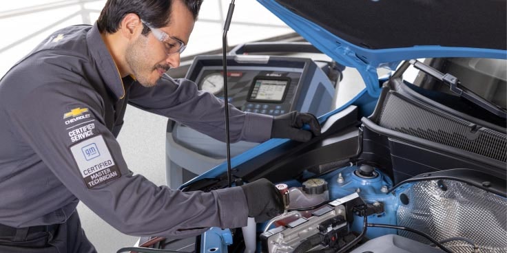 a mechanic servicing a vehicle