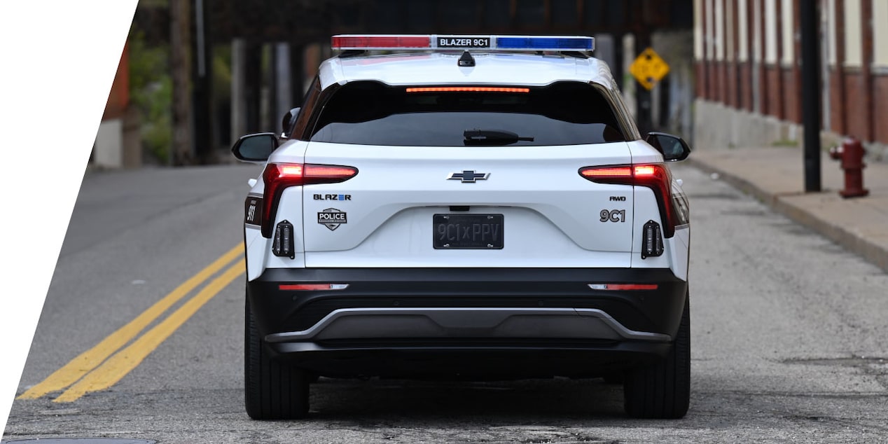 Rear View of the 2024 Chevrolet Blazer EV PPV Driving Through City Streets