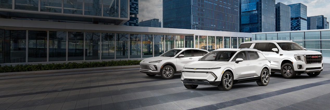 A group of Summit White SUVs for the 2024 Chevrolet Equinox EV, 2024 GMC Yukon, and 2025 Buick Ecnore GX